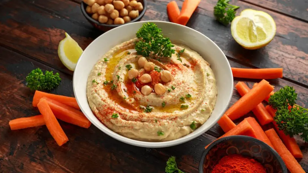 Bowl of homemade hummus: Homemade hummus can be frozen for later use
