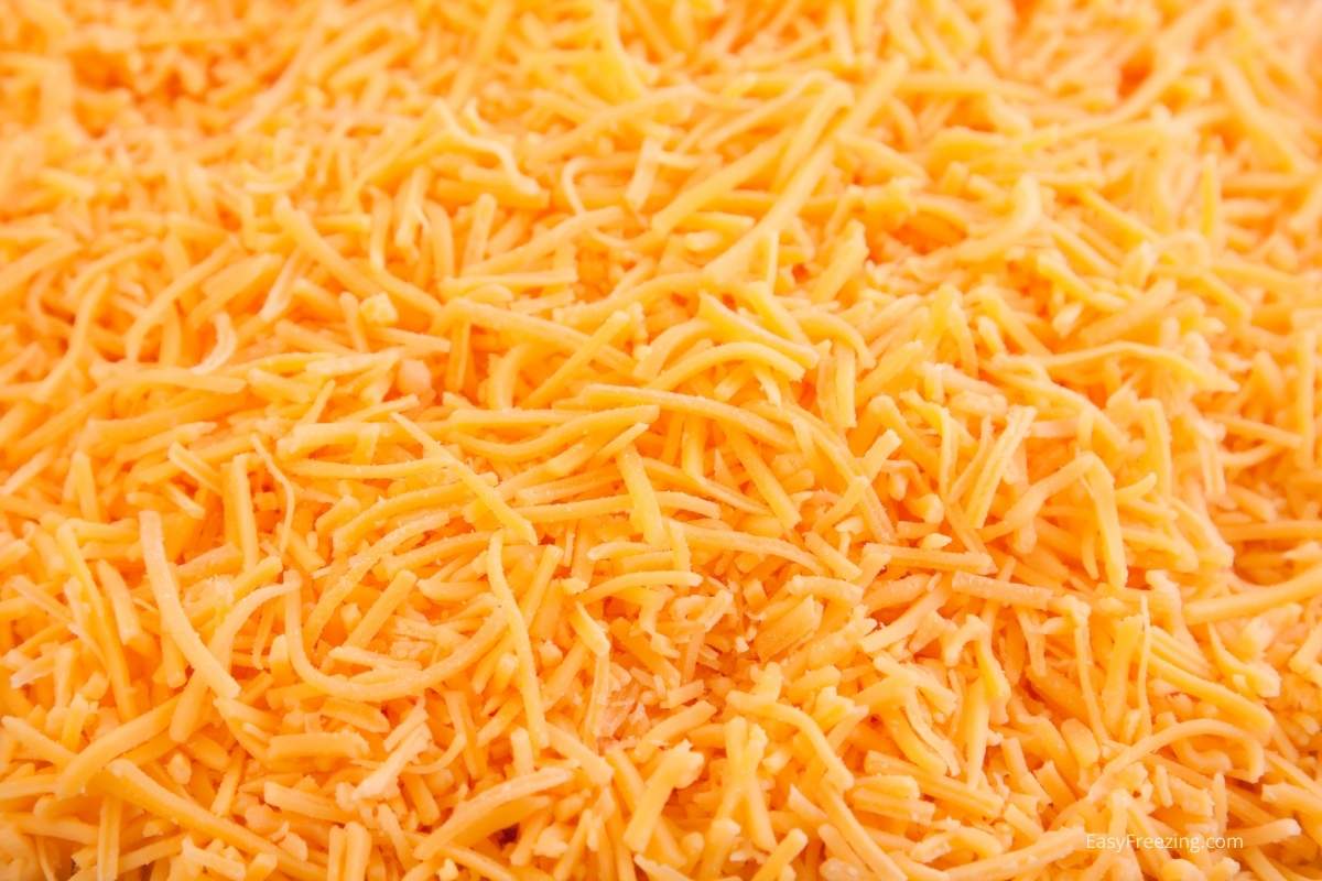 You can easily freeze grated cheddar cheese