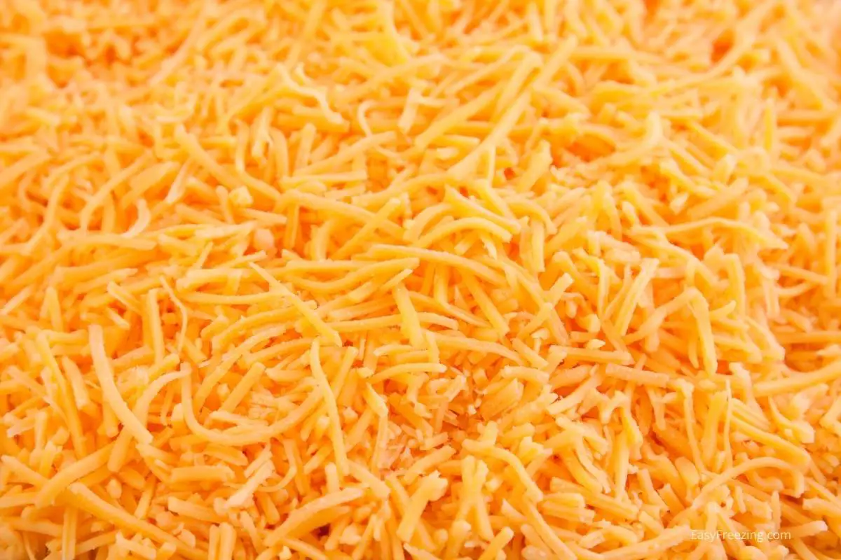 You can easily freeze grated cheddar cheese